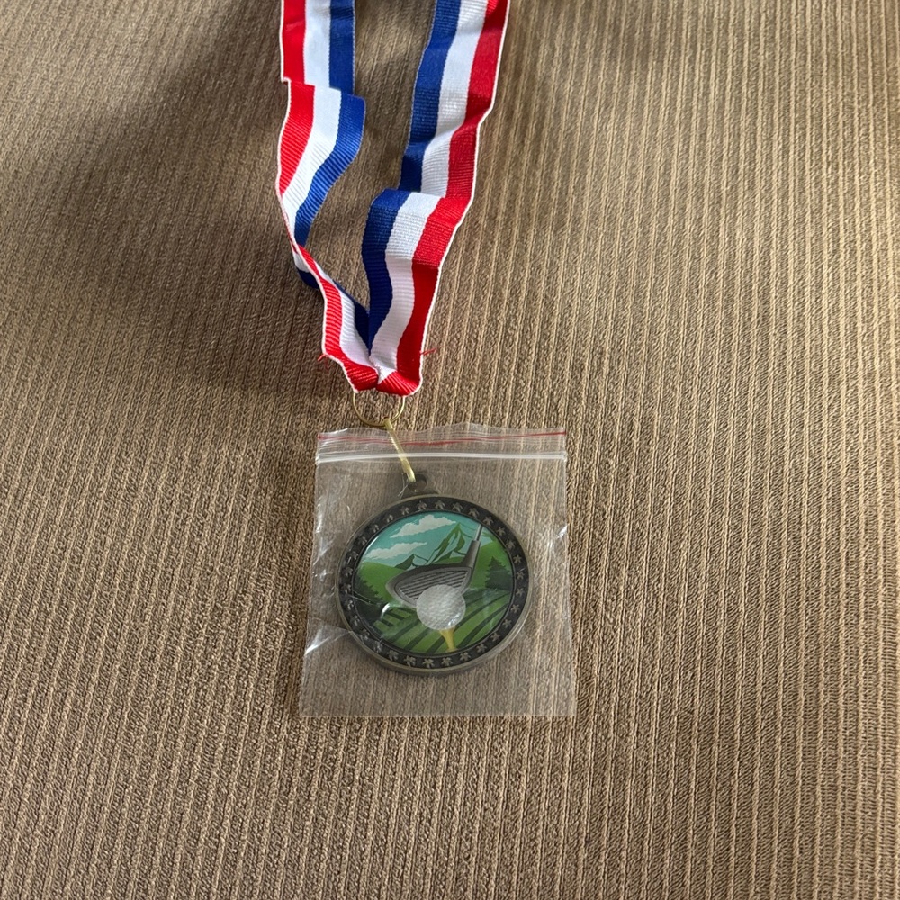 Golf Medal with Red, White, and Blue Ribbon
